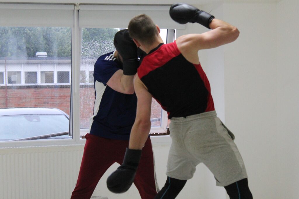 Boxer Mike throwing a body shot