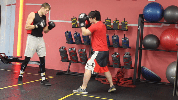 Mike Slowak demonstrating a right uppercut, step to the right, cross, left hook knockout combination.