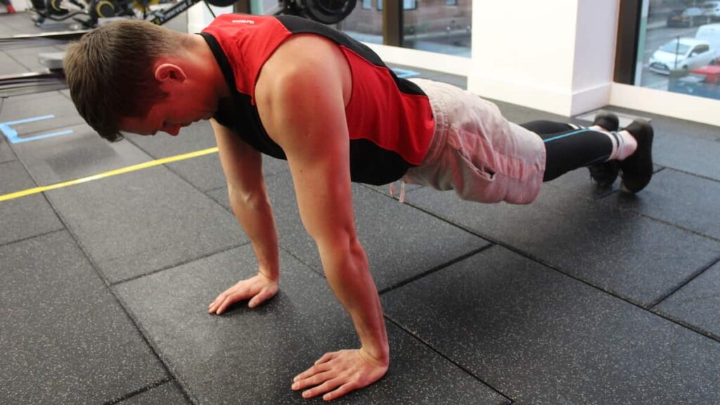 Mike back up to the plank position during the third step of performing the standard proper pushup form.