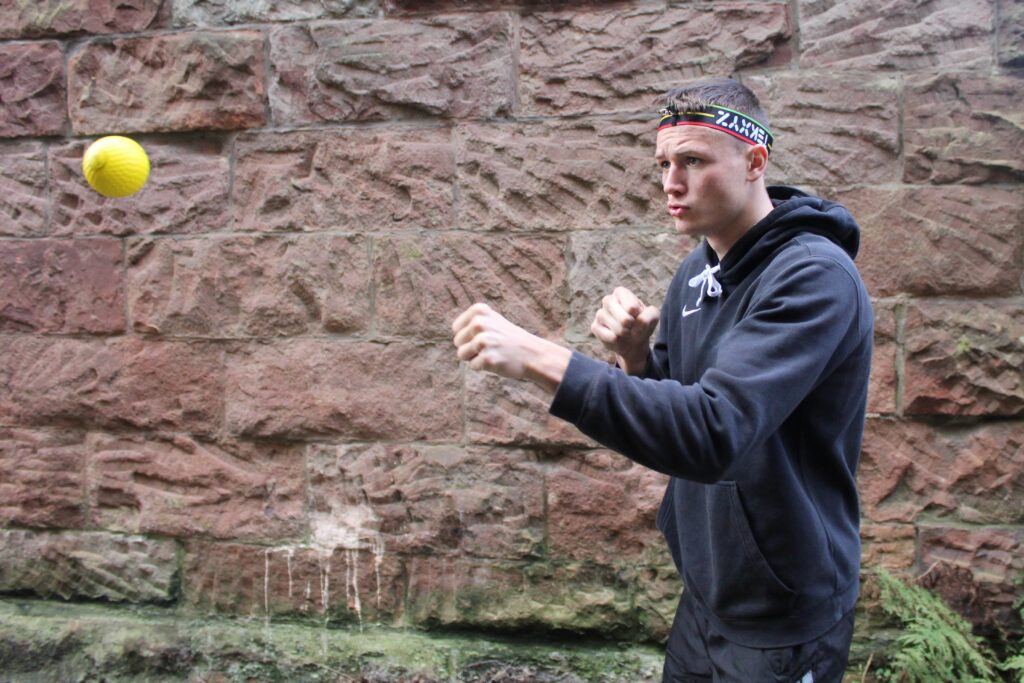 Boxer Mike training with a reflex ball to train for a faster jab