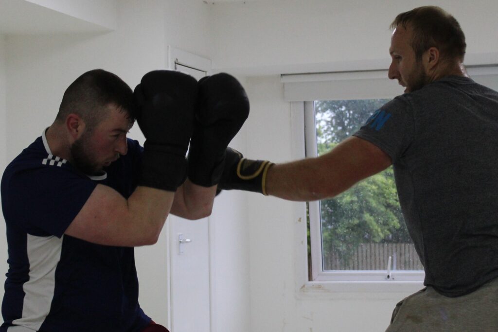 boxer throwing fast jab to another boxer.