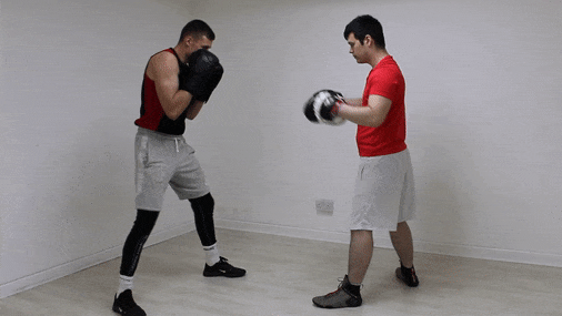 The boxing combo involving the left uppercut, right uppercut, and left hook