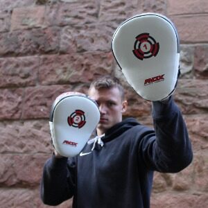 Boxer Mike holding boxing focus pads