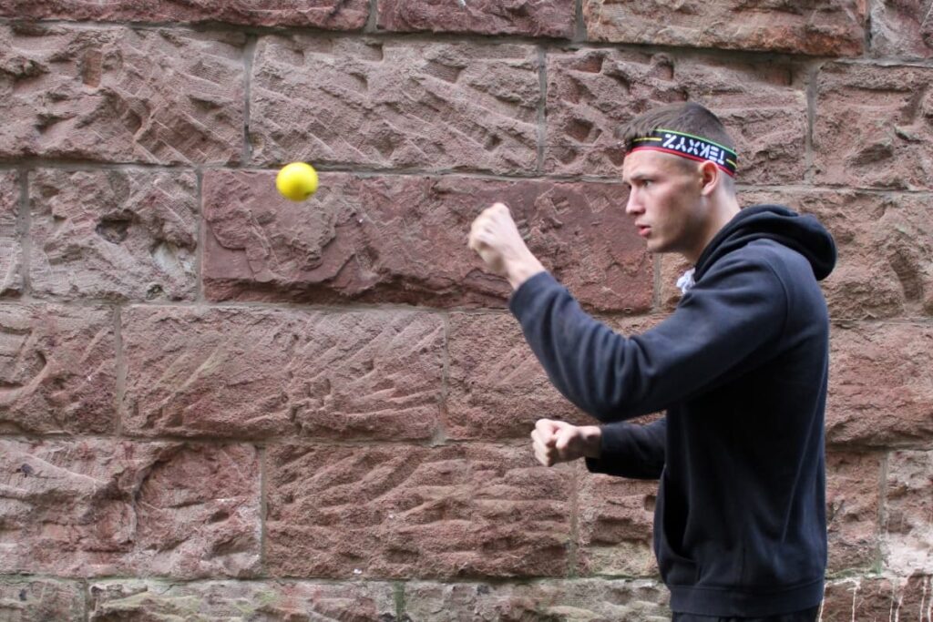 boxer using a reflex ball to stop flinching