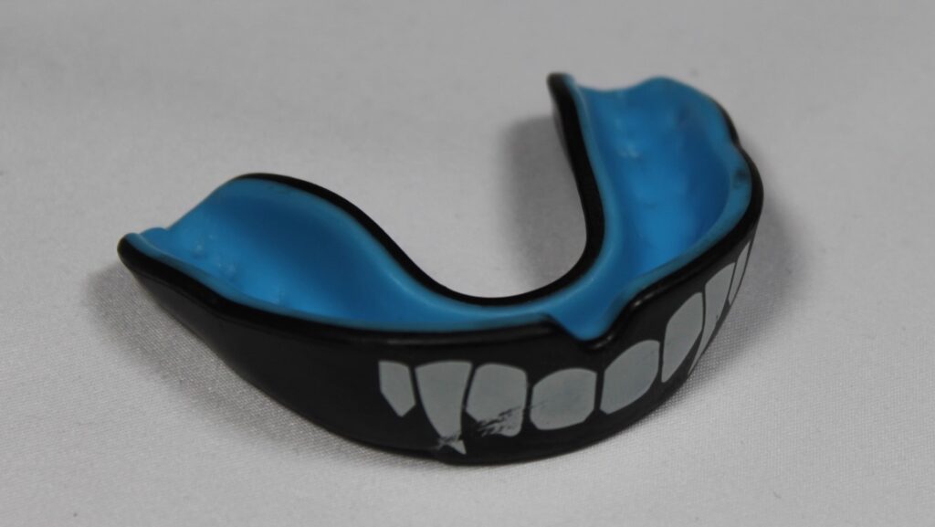 A boxing mouthguard with fangs texture.