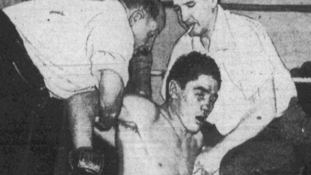 Jimmy Doyle being helped off the canvas after facing Sugar Ray Robinson.