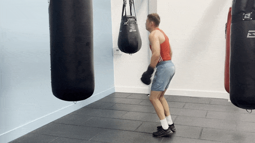 The knees-to-chest jumps as part of the punching bag workout's 11th round