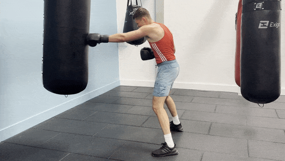 Demonstration of non-stop straight punches as part of the 12th round of the heavy bag workout