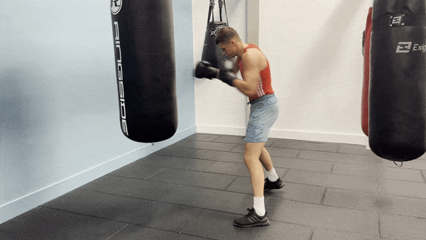 A demonstration of the straight punches in the heavy bag in round 10 of the workout