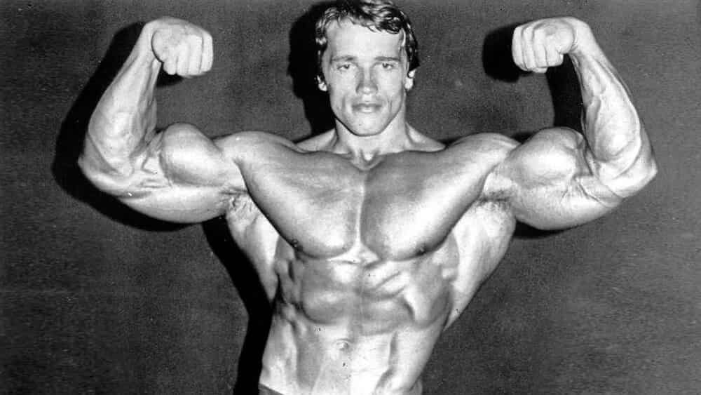 Arnold Schwarzenegger showing his biceps.
